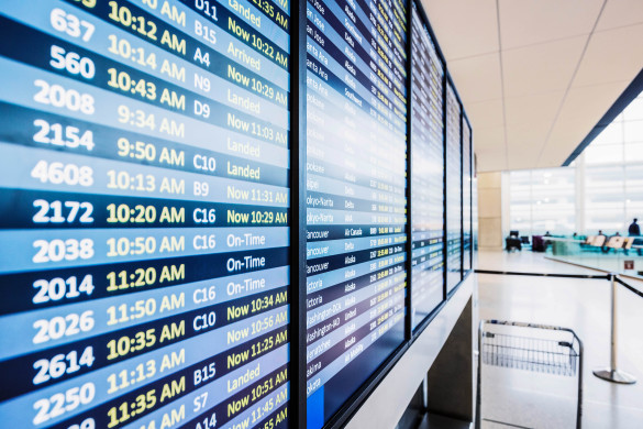 info of flight on billboard in airport