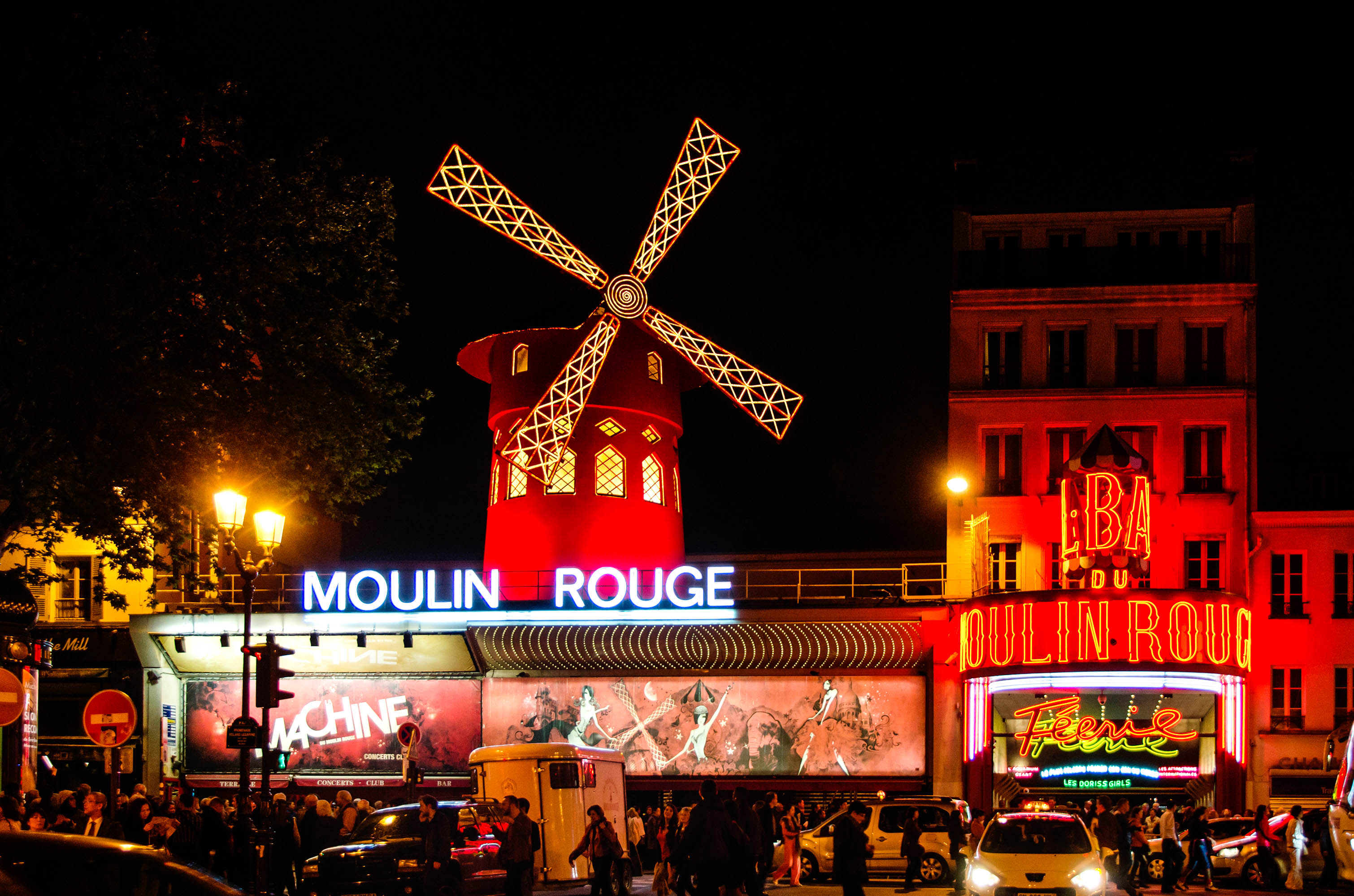 PARIS - APRIL 30: The Moulin Rouge by night, on April 30, 2014 in Paris, France. Moulin Rouge is a famous cabaret built in 1889, locating in the Paris red-light district of Pigalle