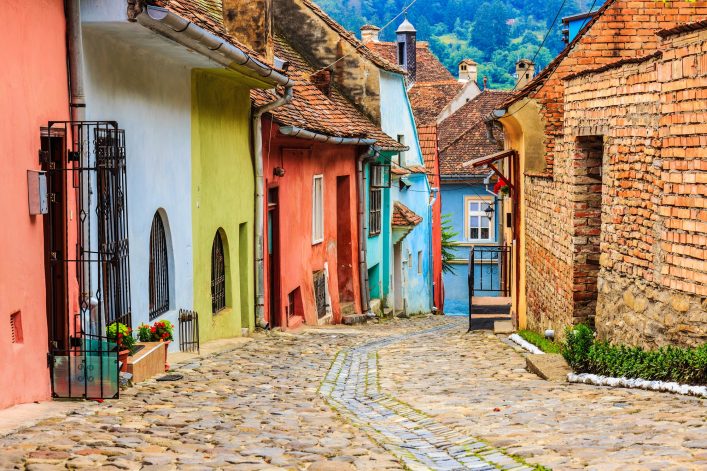 medieval-street-view-in-sighisoara-founded-by-saxon-colonists-in-xiii-century-romania-shutterstock_209243932-2